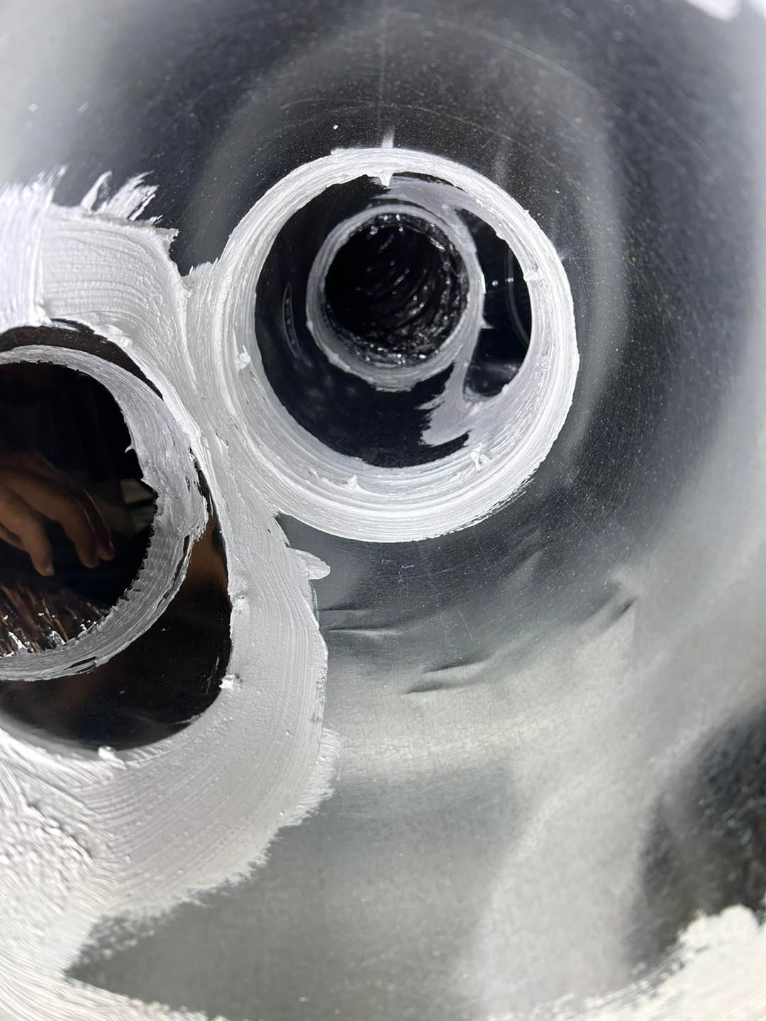 A close up of a pipe with two holes in it.