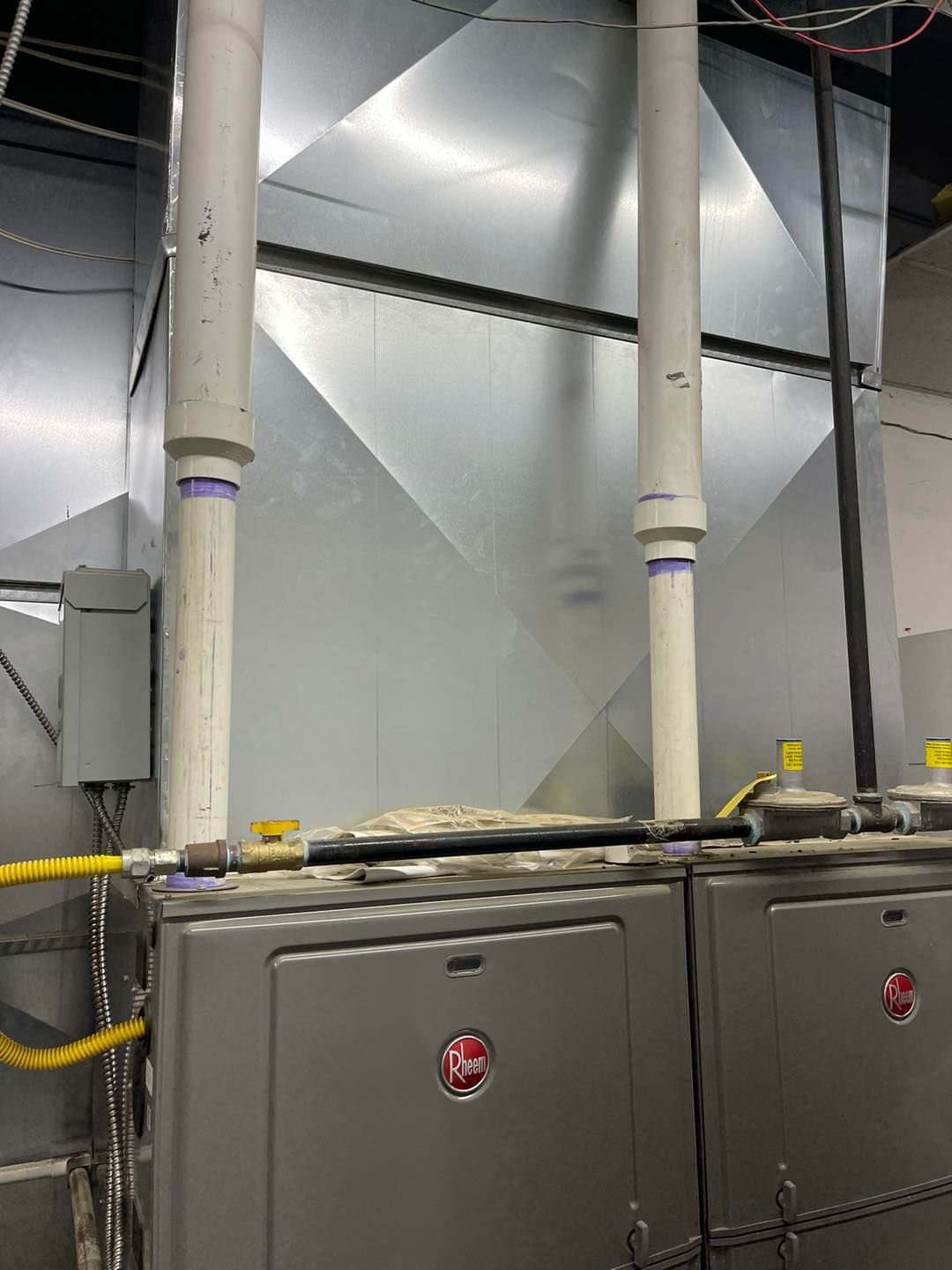 A room with a lot of pipes coming out of it.