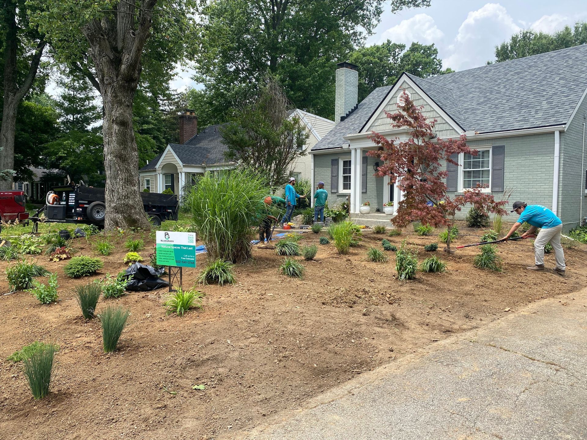 A large house with a concrete driveway in front of it.