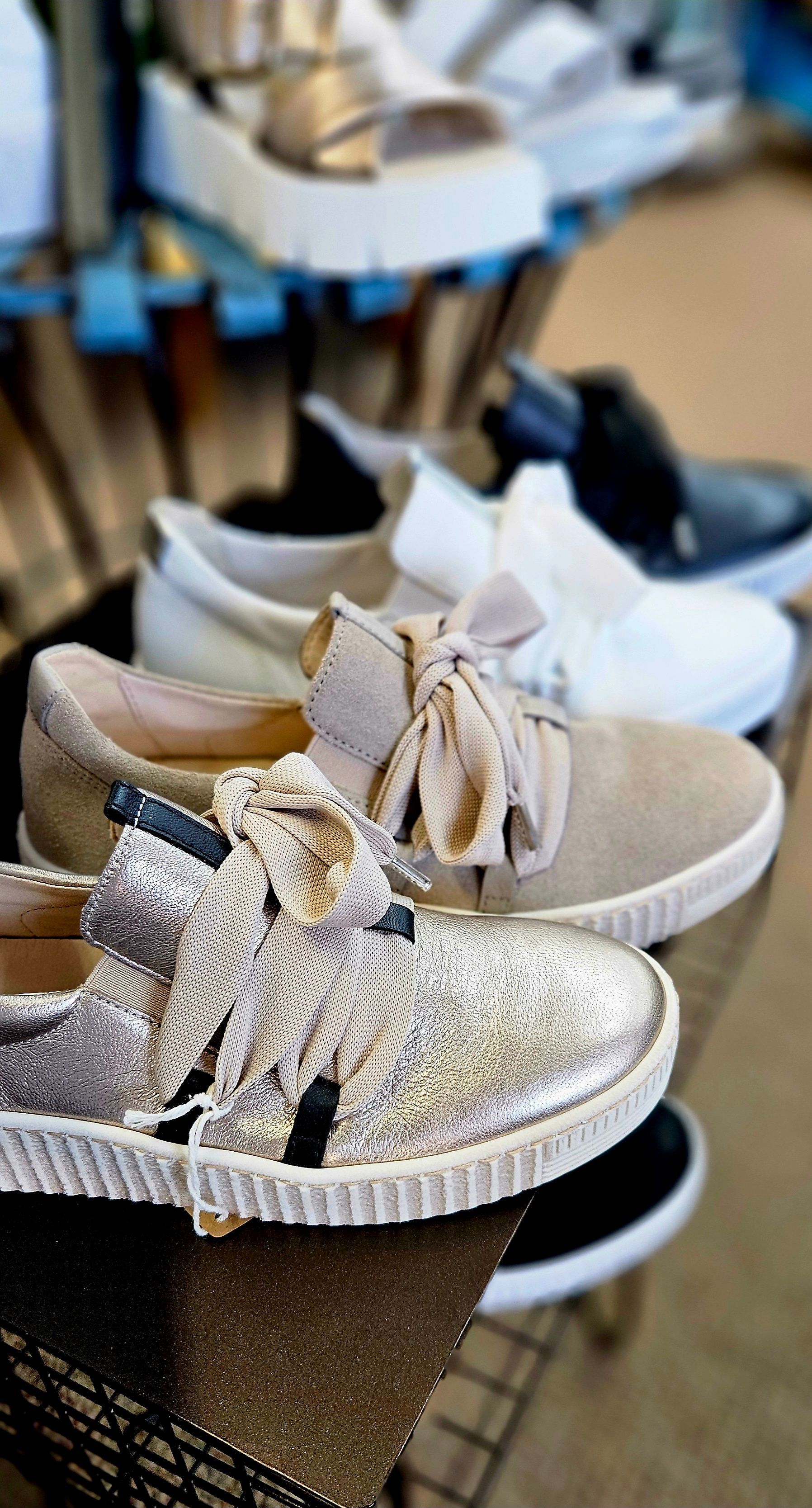 A close up of a shoe with a yellow sole