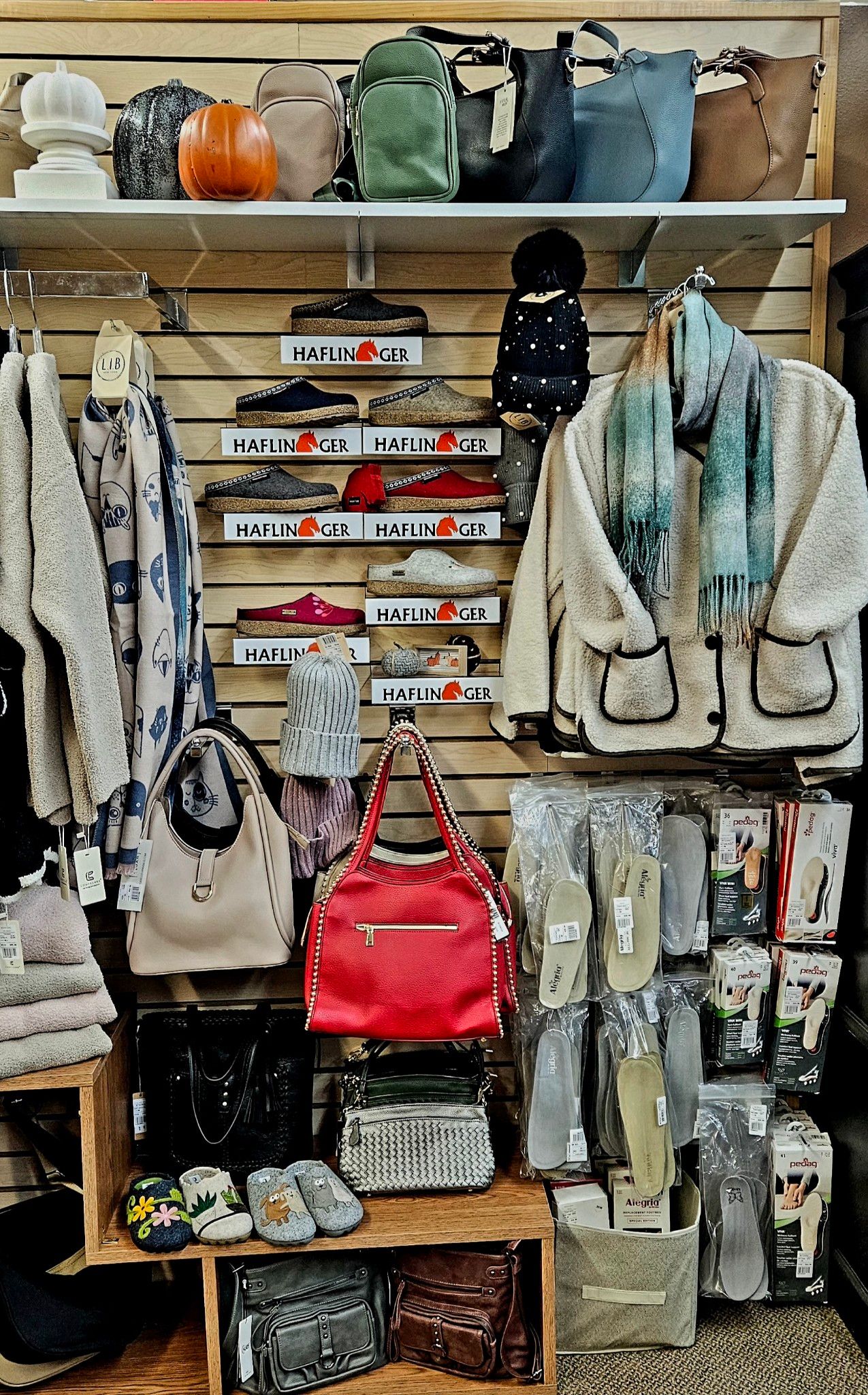 A store filled with lots of clothes and handbags.