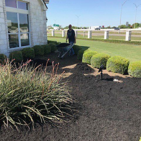 Man Holding a Cart — San Marcos, TX — Diamondback Landscaping & Lawn Care, Inc.