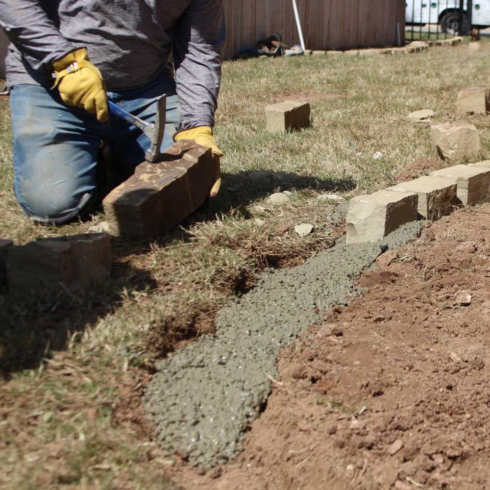 Man Installing Pathway — San Marcos, TX — Diamondback Landscaping & Lawn Care, Inc.