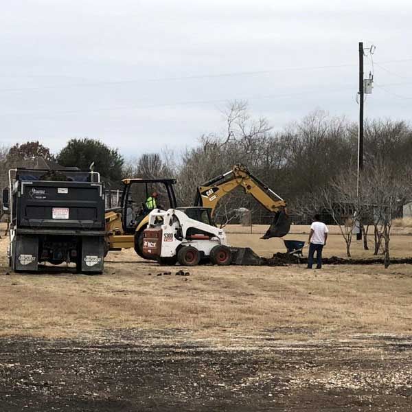 Small Backhoe — San Marcos, TX — Diamondback Landscaping & Lawn Care, Inc.