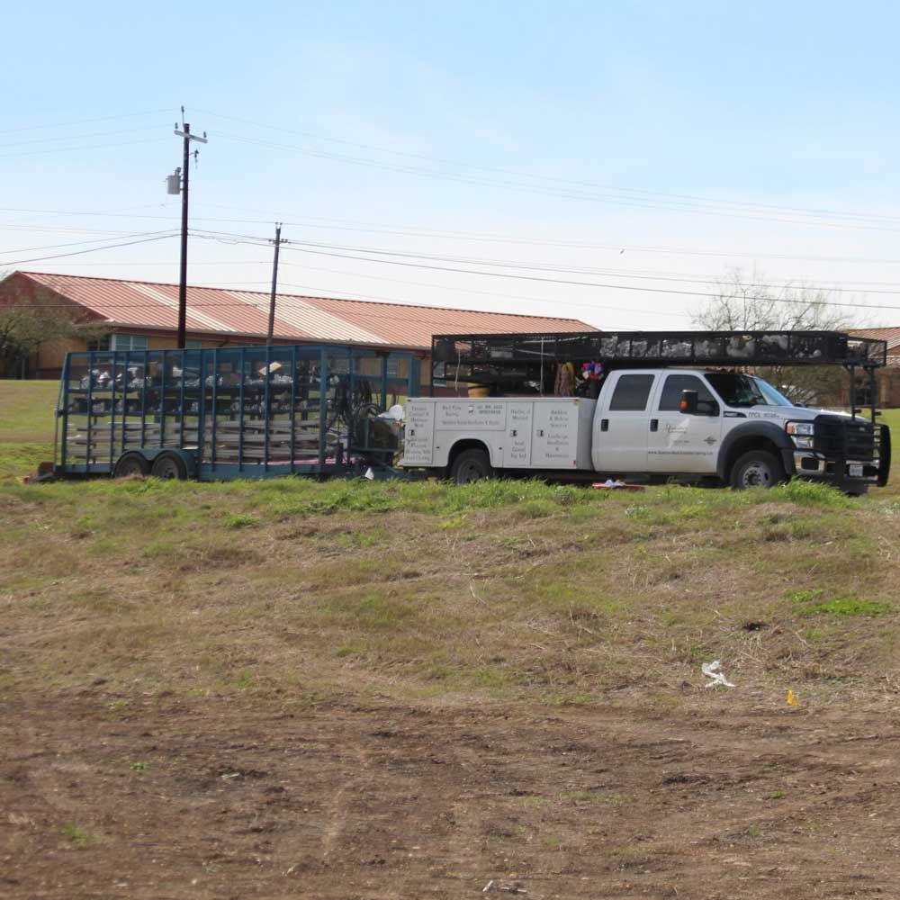White Truck Pulling a Carriage — San Marcos, TX — Diamondback Landscaping & Lawn Care, Inc.