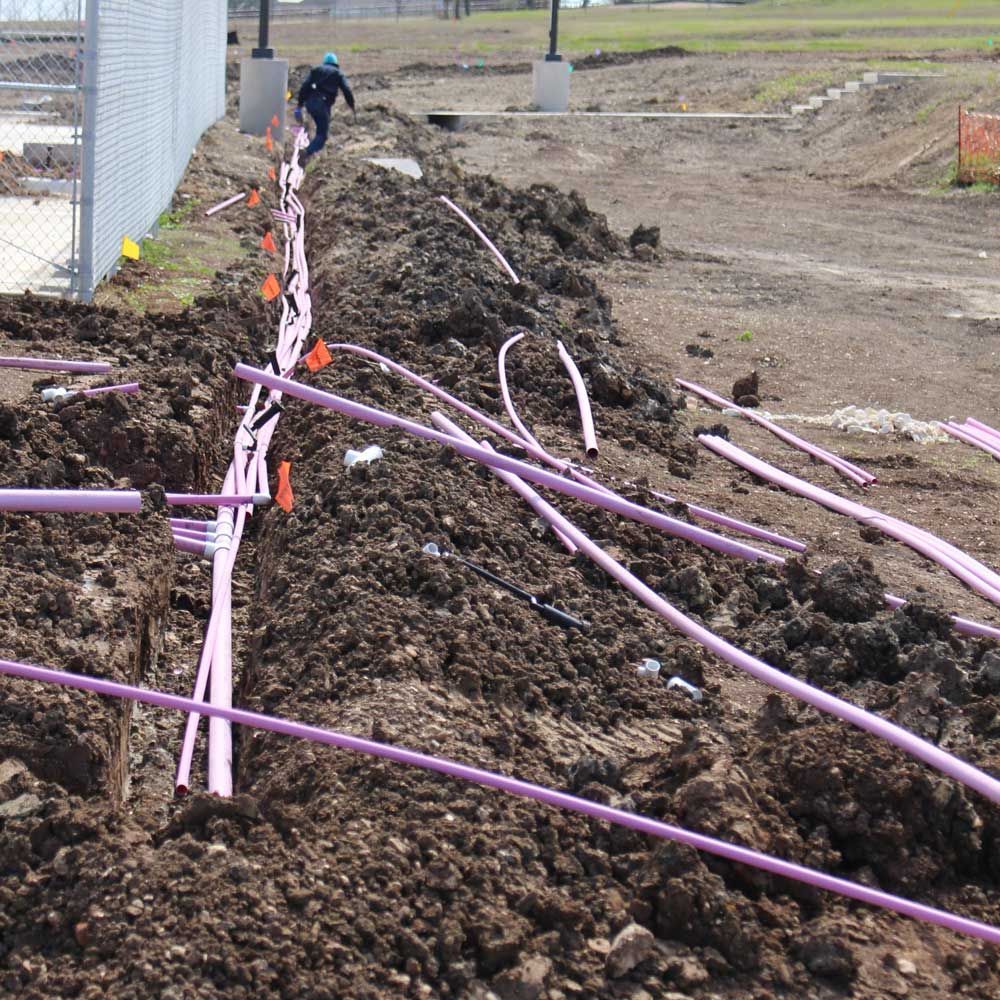 Lining up Pipes — San Marcos, TX — Diamondback Landscaping & Lawn Care, Inc.