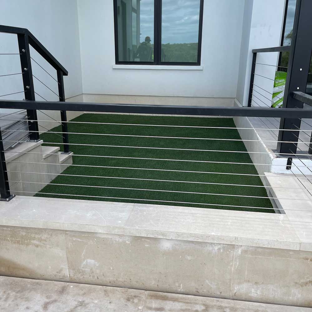 House with Artificial Turf — San Marcos, TX — Diamondback Landscaping & Lawn Care, Inc.