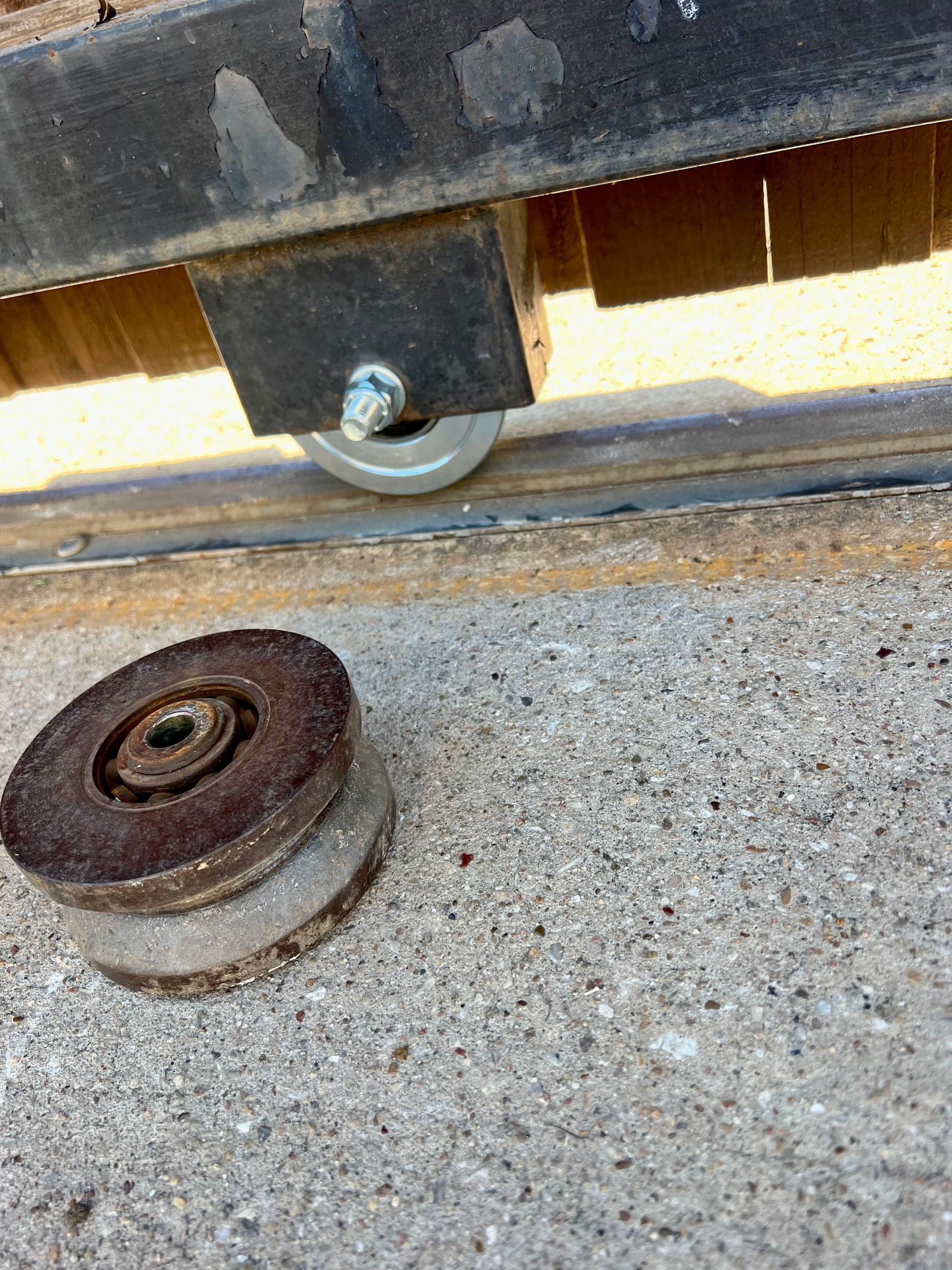 A close up of a wheel on a concrete surface.