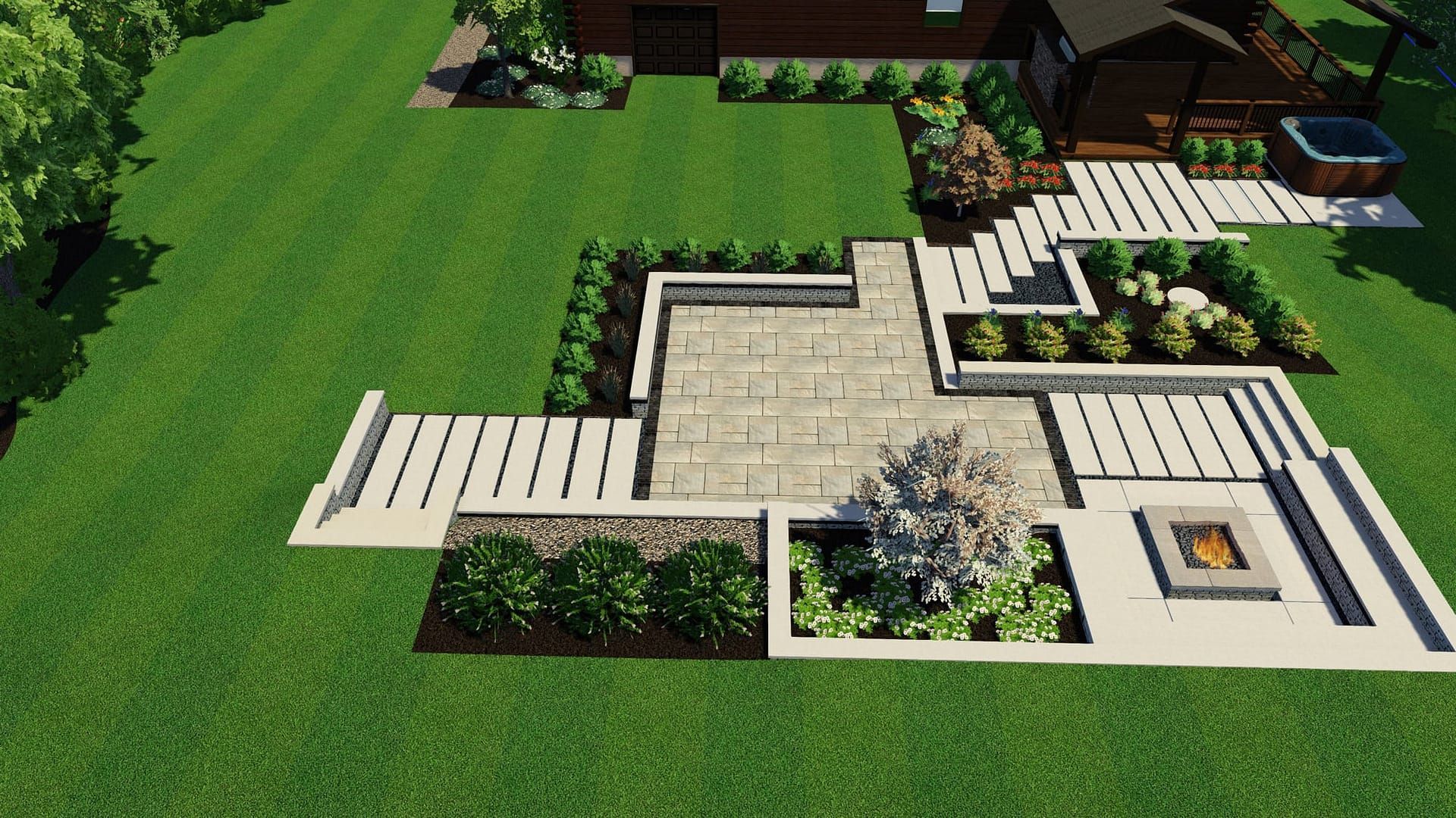 Top-down view of a modern backyard patio with a fire pit, steps, and lush landscaping in a green lawn.