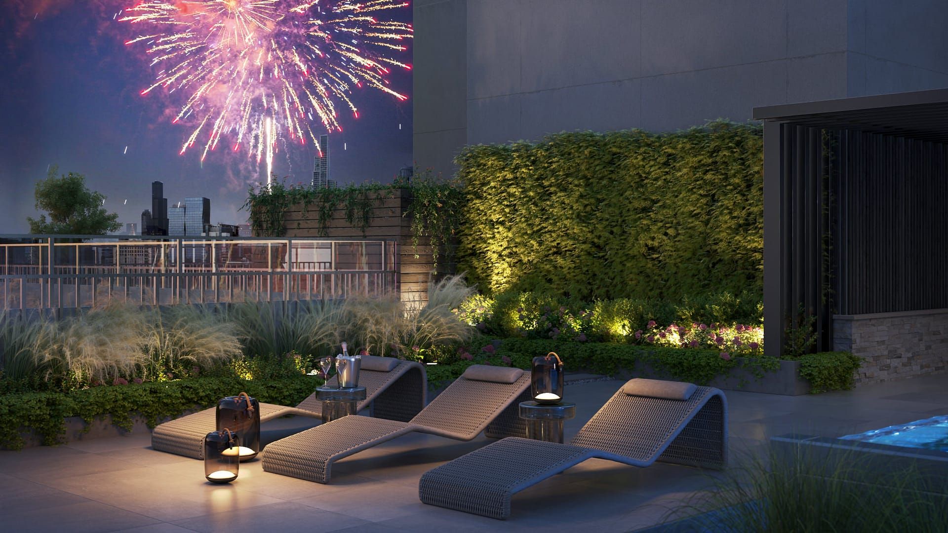 Rooftop lounge with chairs, fireworks overhead, and lights illuminating the space at night.