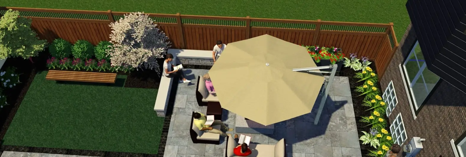 Overhead view of a backyard patio with furniture, an umbrella, and surrounding green space.