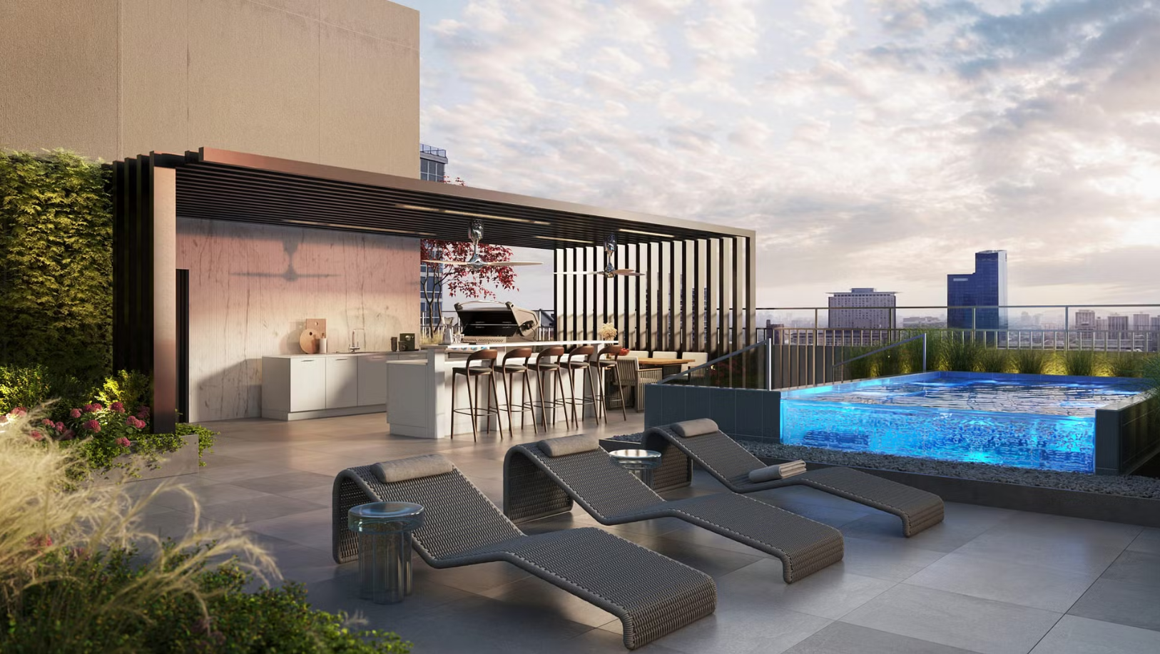 Rooftop patio with lounge chairs, small pool, outdoor kitchen, and cityscape view.