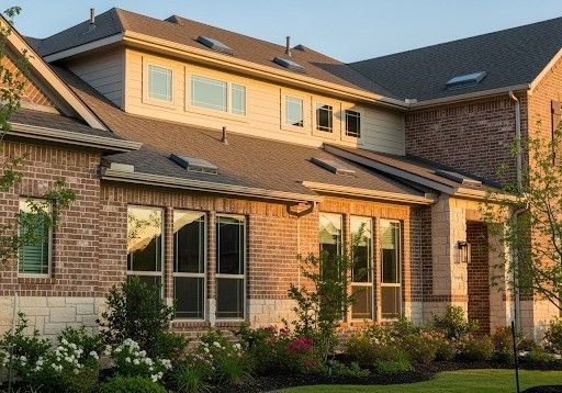 house with visible attic vents and energy-efficient windows
