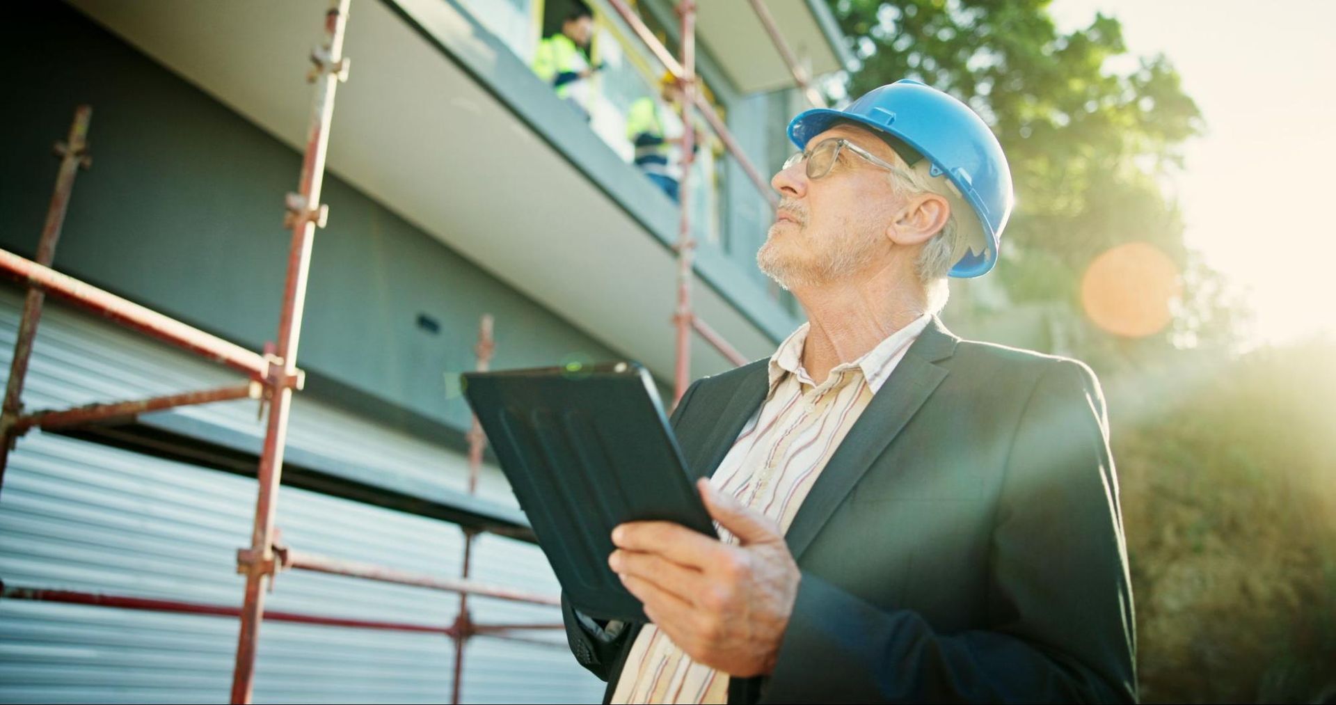 Inspector examining roof and gutters during a comprehensive home inspection in Greater Houston.