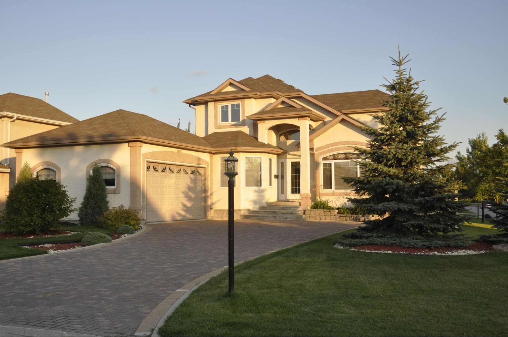 Exterior of a single family home in a neighborhood, representing a professional home inspection 