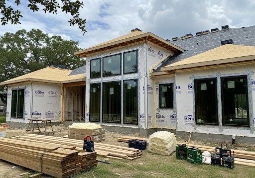 home under construction with energy-efficient windows and sealed framing details