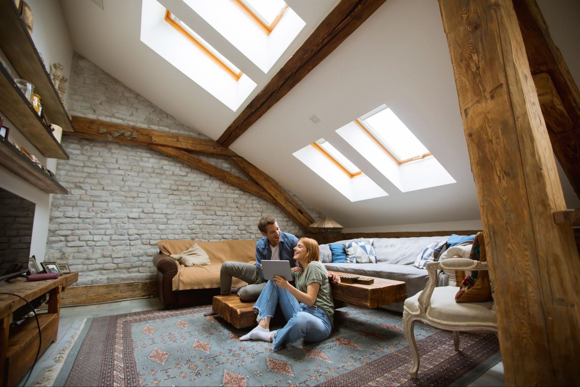 couple relaxing in an attic