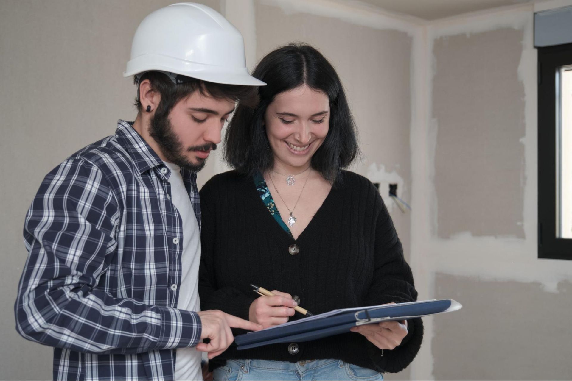 Home inspector and homeowner reviewing the layout during a home inspection.