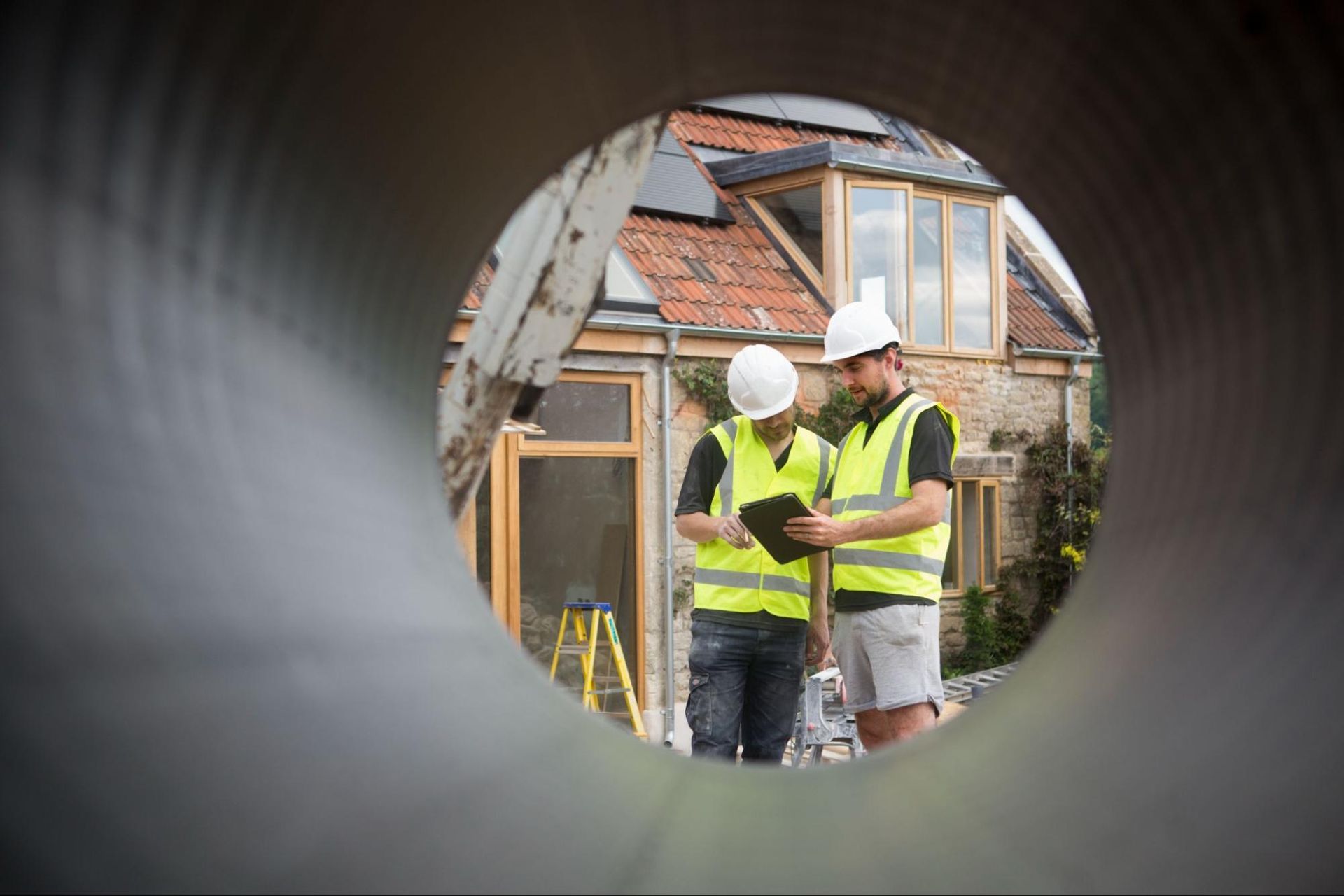 workers in hard hats conducting a home inspection