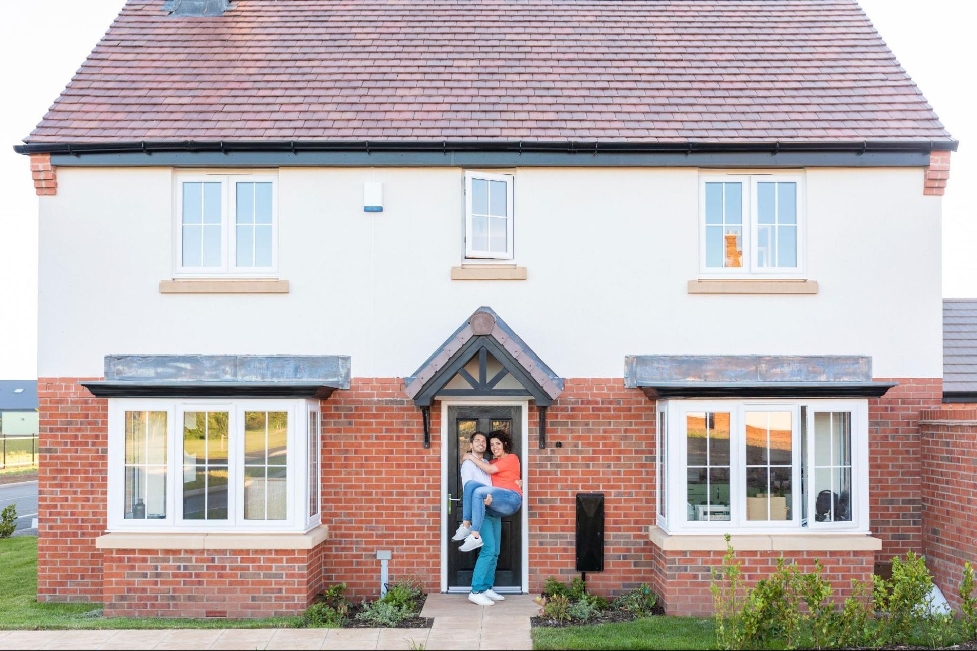 couple in their new house, representing the importance of home inspection for new builds