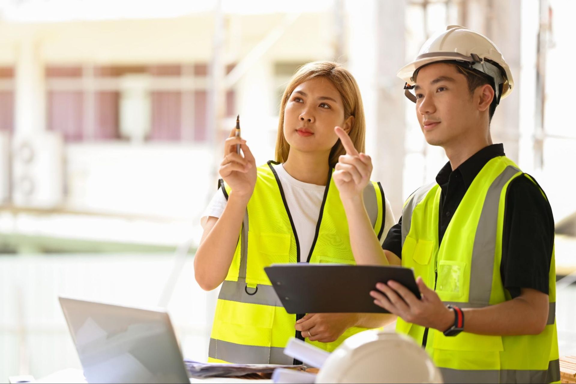 Inspectors coordinating details of a home inspection project.
