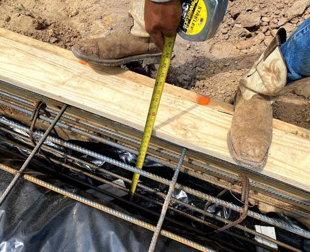 Construction-worker-holding-measuring-tape
