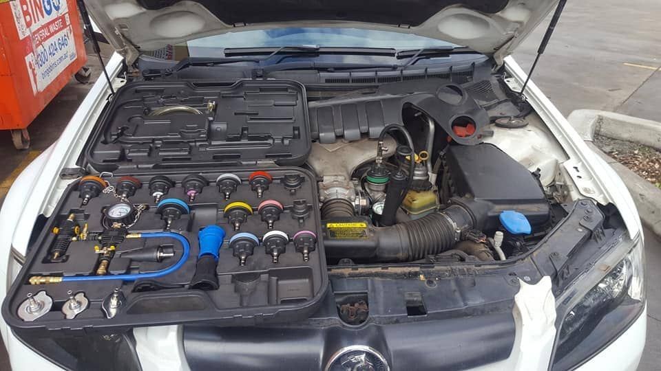 Mechanic Working on Car Engine — Auto Repair Services in Picton, NSW