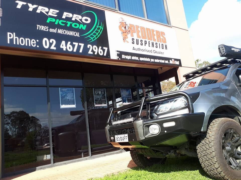 Fitting Car Wheels — Auto Repair Services in Picton, NSW