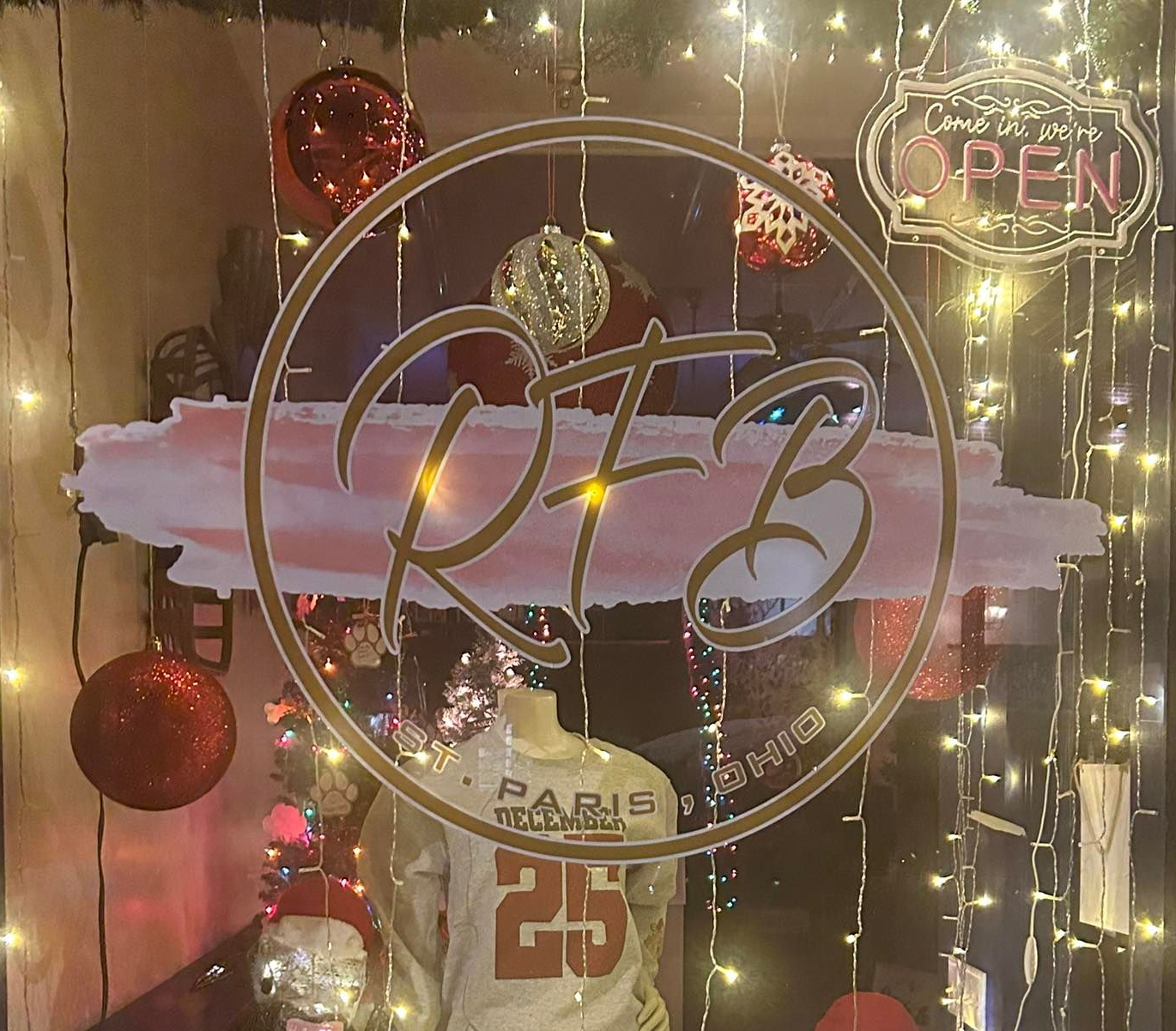 Logo for Ruthie's Farmhouse Boutique: gold text 