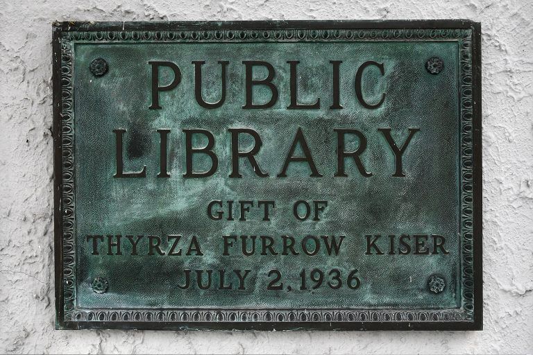 Bronze plaque reads: 