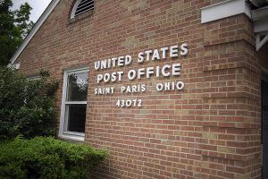 United States Post Office building in Saint Paris, Ohio, with brick exterior, window, and address 43072.