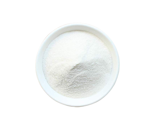 A white bowl filled with raw chocolate chips on a white background