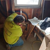 Employee fixing plumbing issue