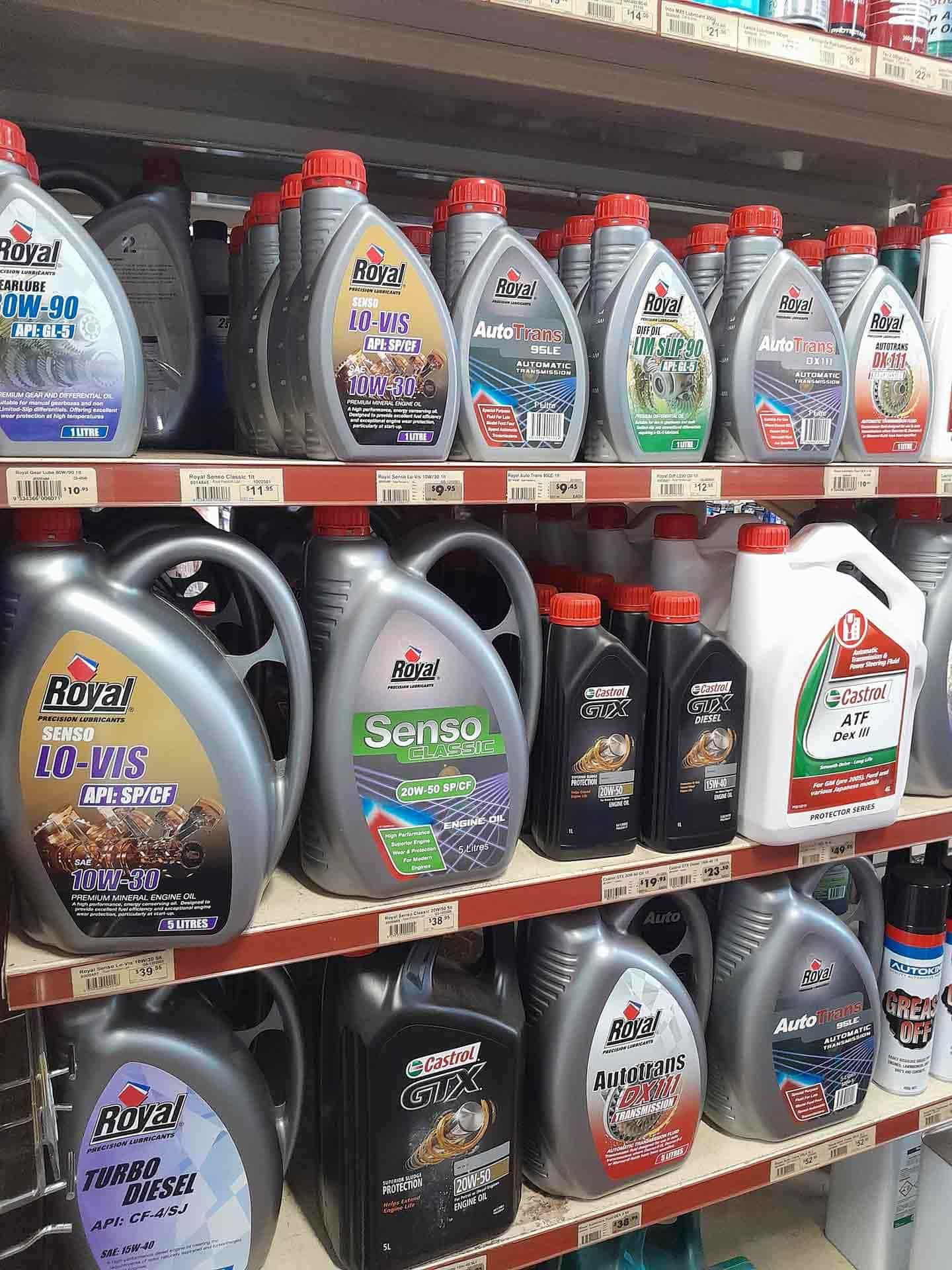A Shelf Filled With Lots Of Bottles Of Oil — Proston Rural Supplies In Proston, QLD