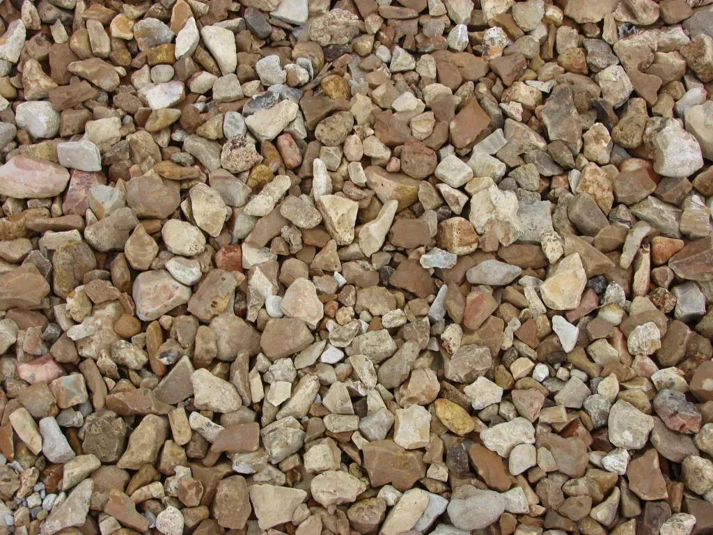 A pile of rocks is sitting on the ground.