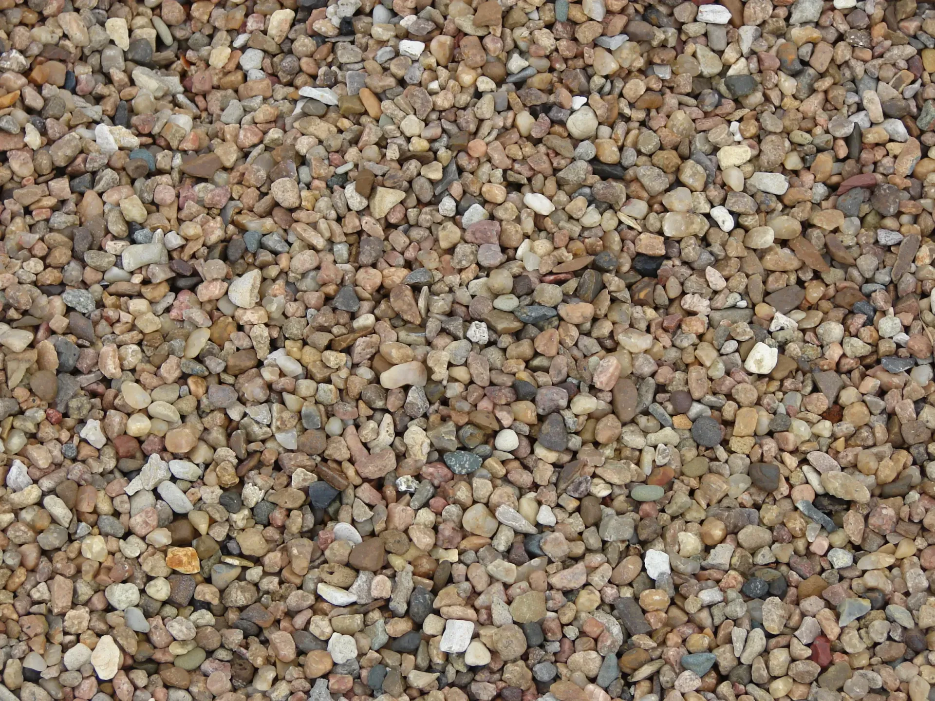 A pile of gravel is sitting on the ground.
