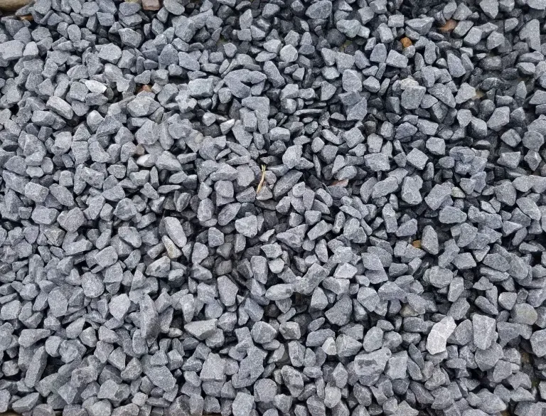 A pile of gravel is sitting on the ground.