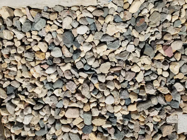 A pile of rocks is sitting on the ground.