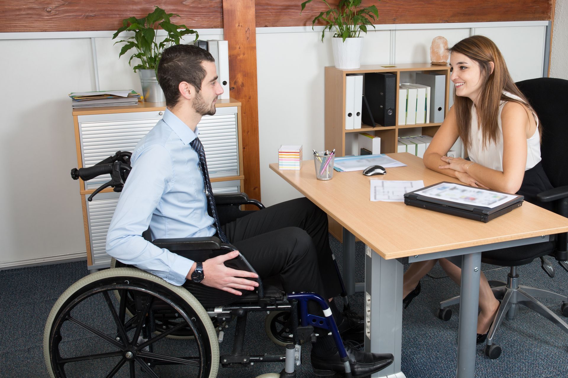 Workplace with a person in a wheelchair