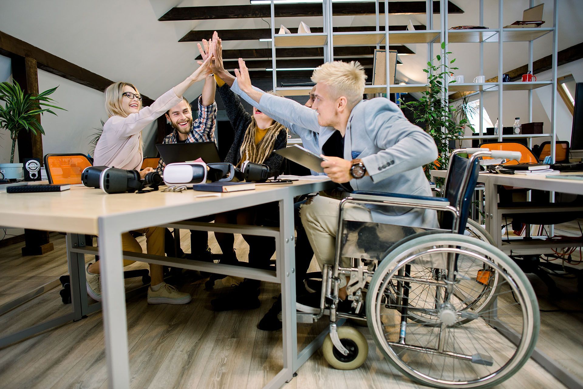 young people giving high five to each other