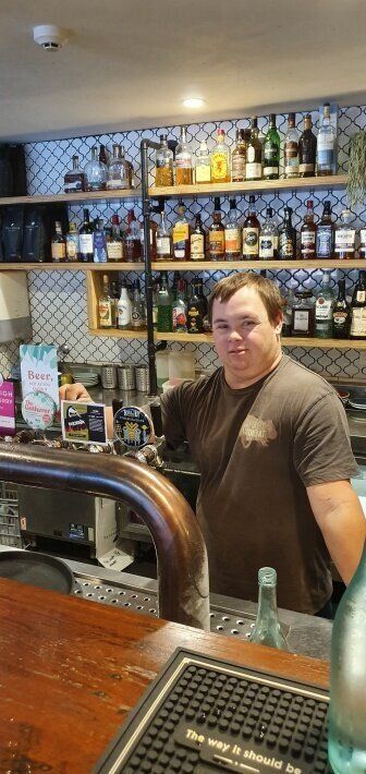Ben behind the bar at The Happy Wombat