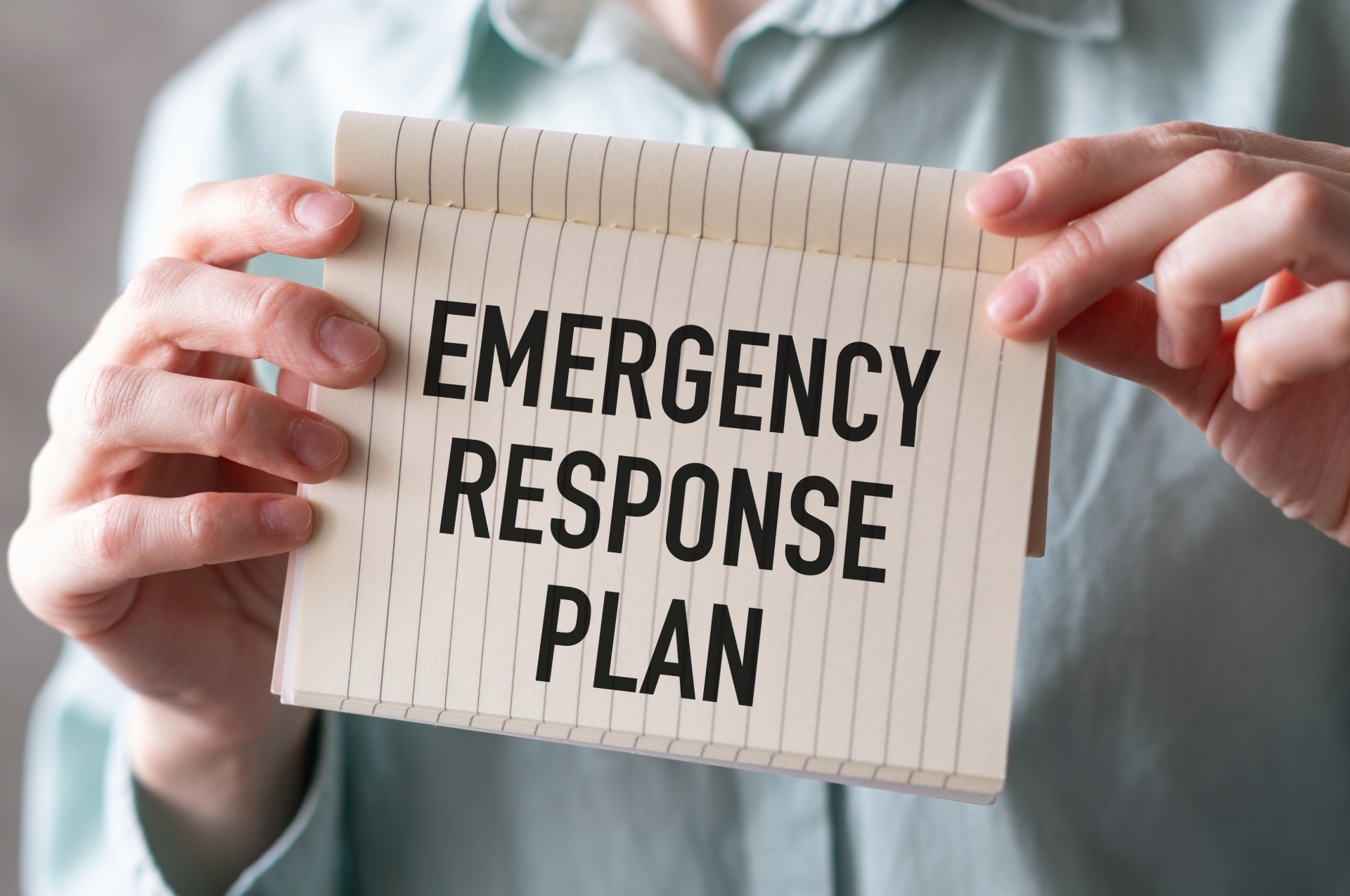 Person holding a card that reads