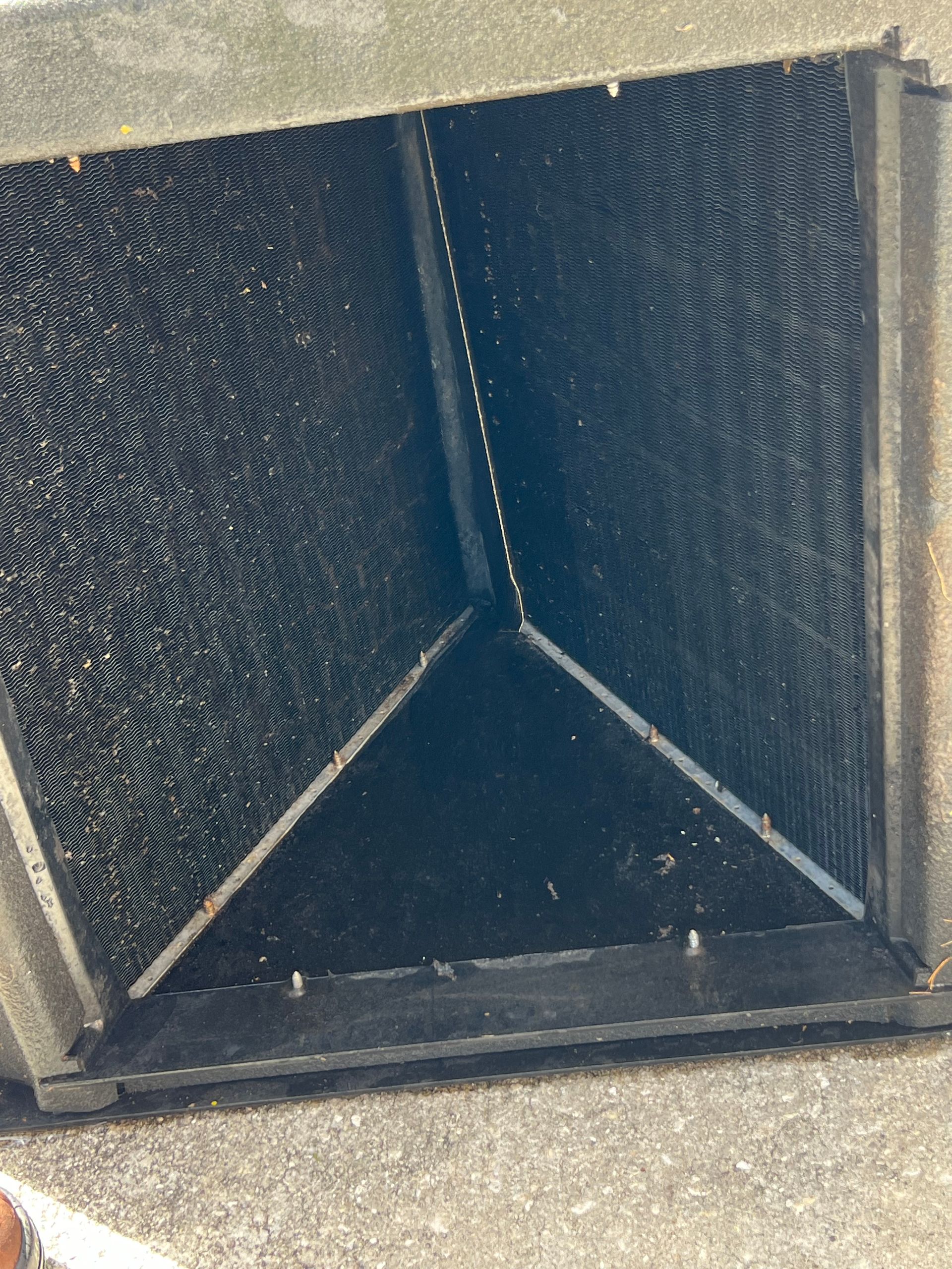 a person is holding a piece of paper in front of a black box .