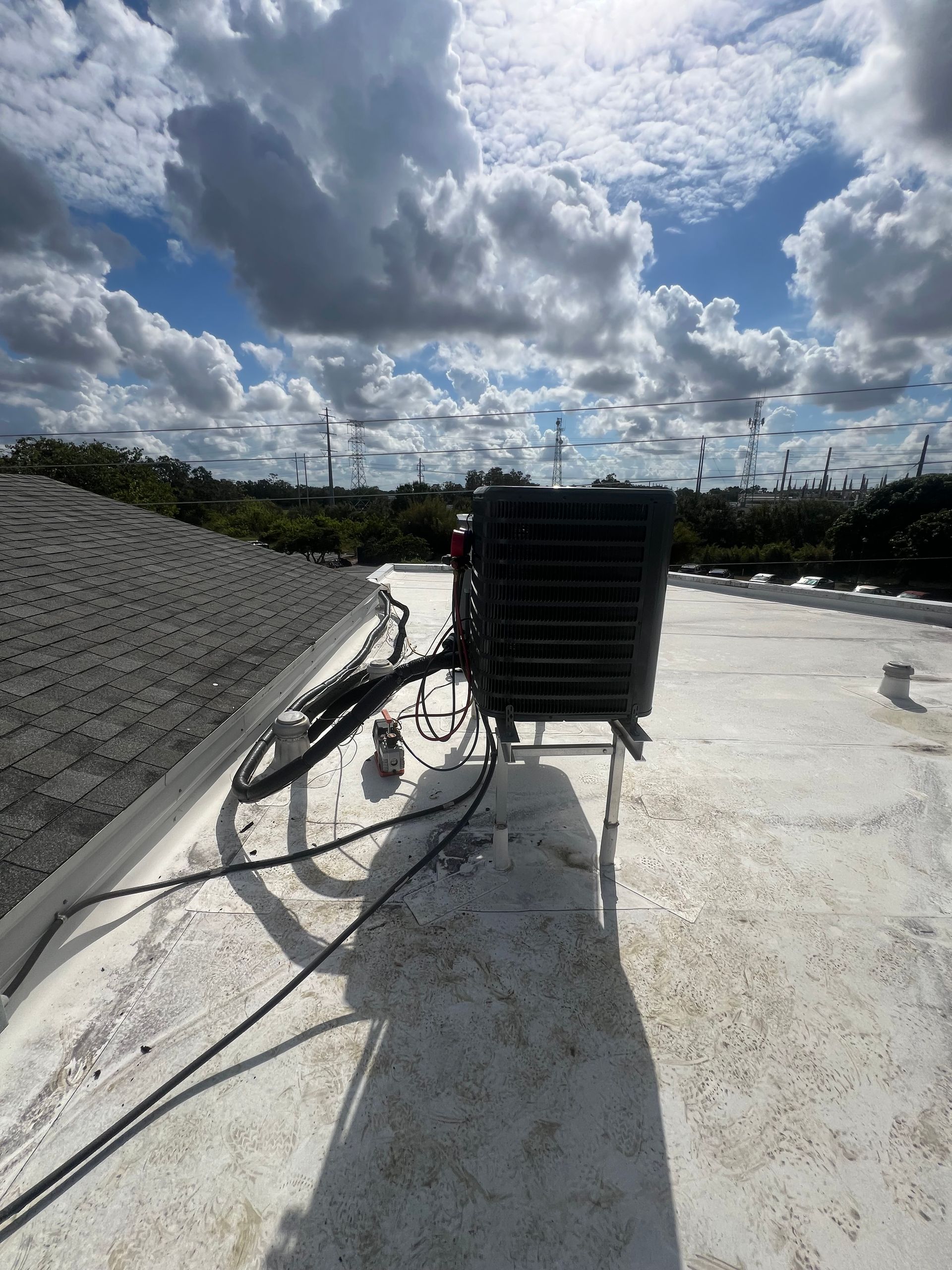 a black box is sitting on top of a white roof .