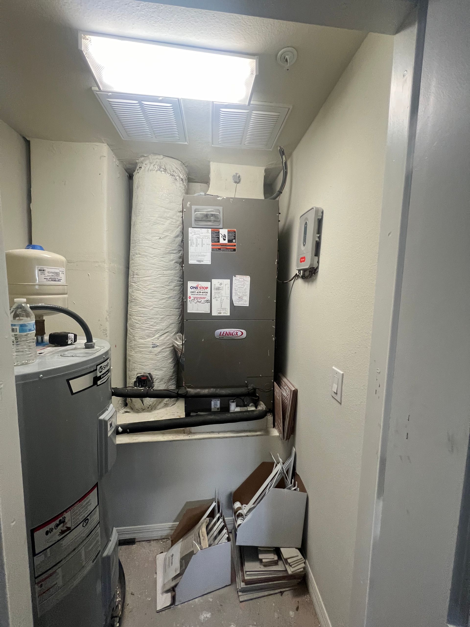 a room with a heater and a water heater in it .