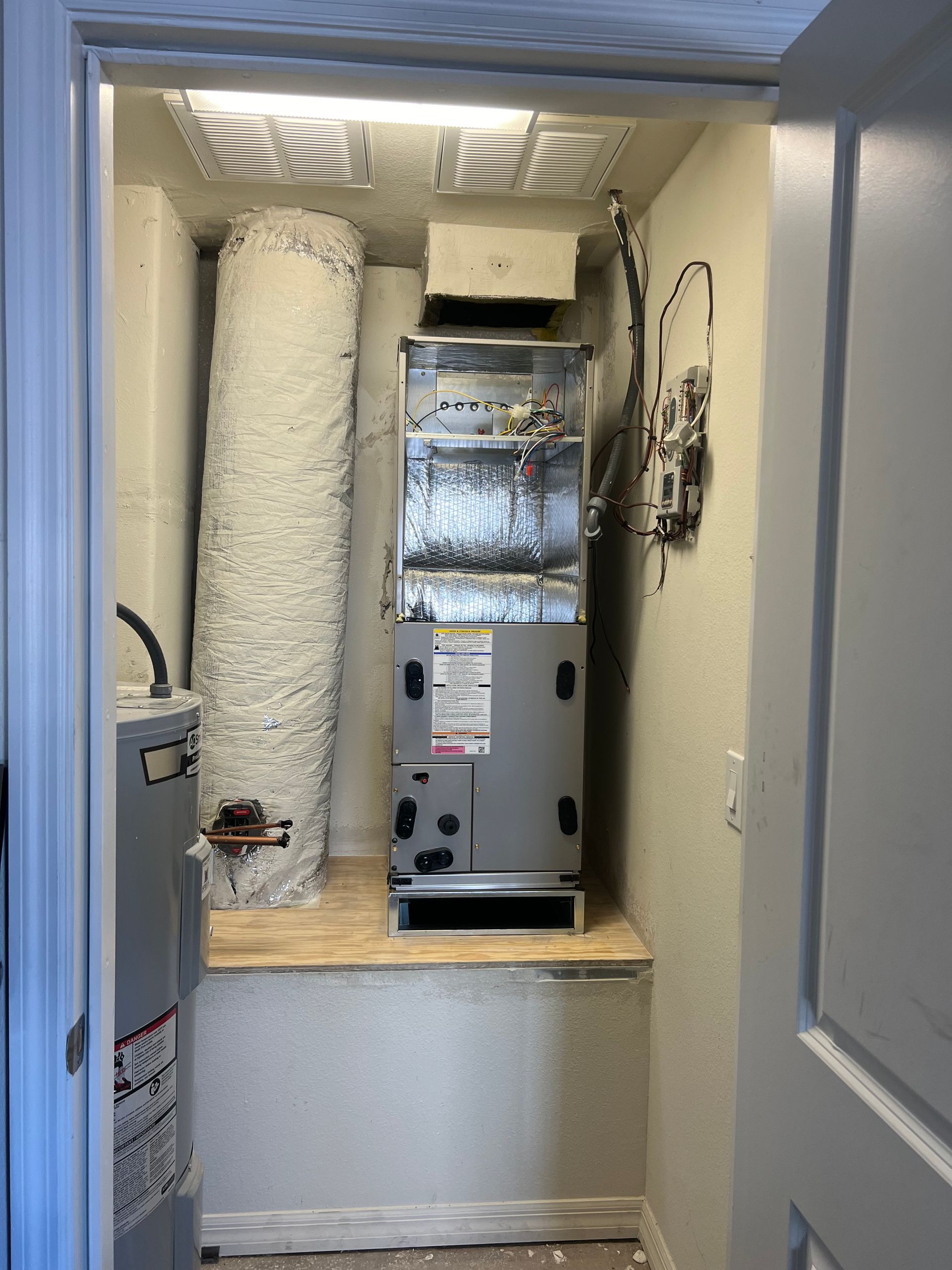 a room with a heater and a door that is open