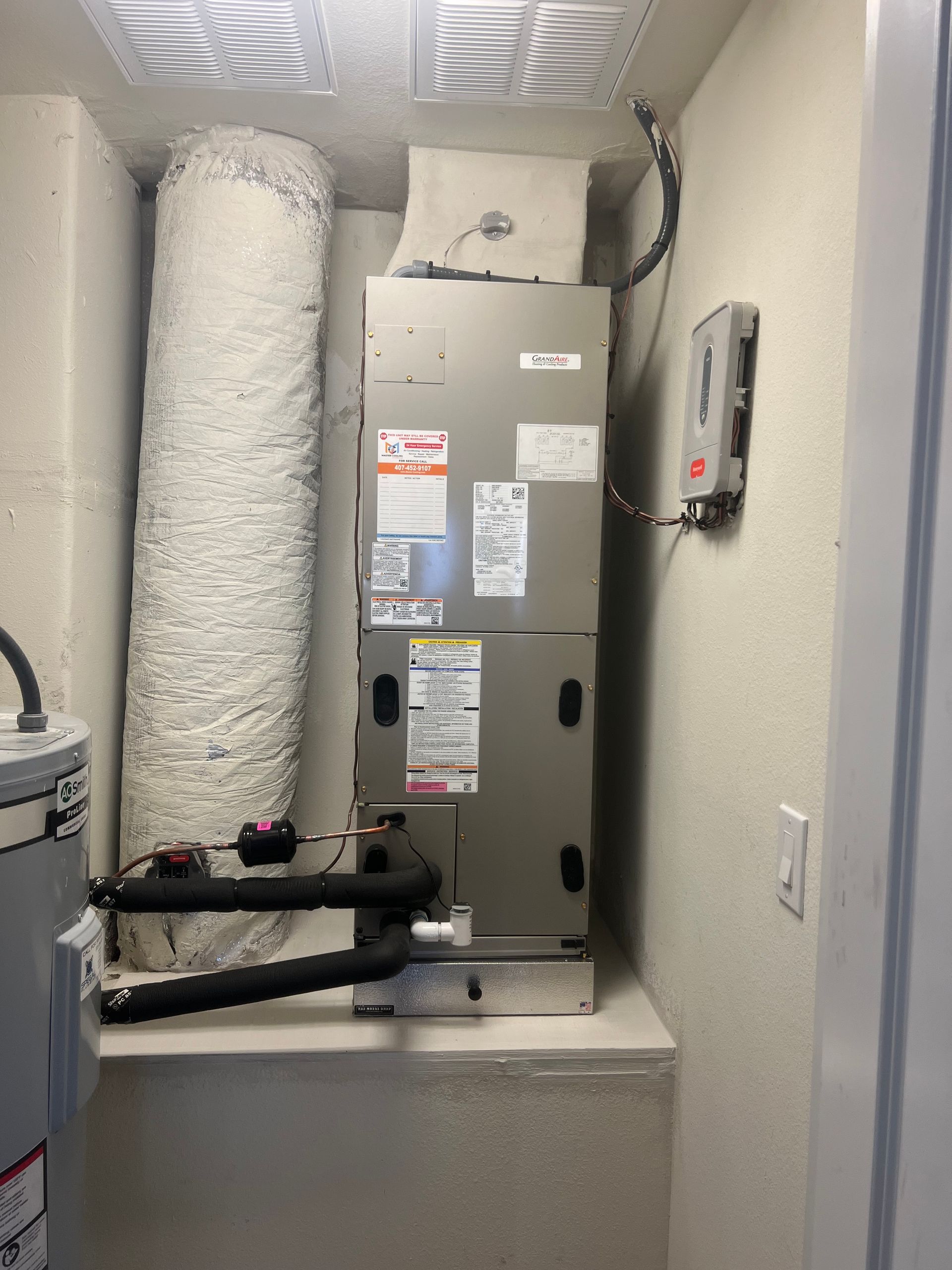 a room with a heater and a water heater in it