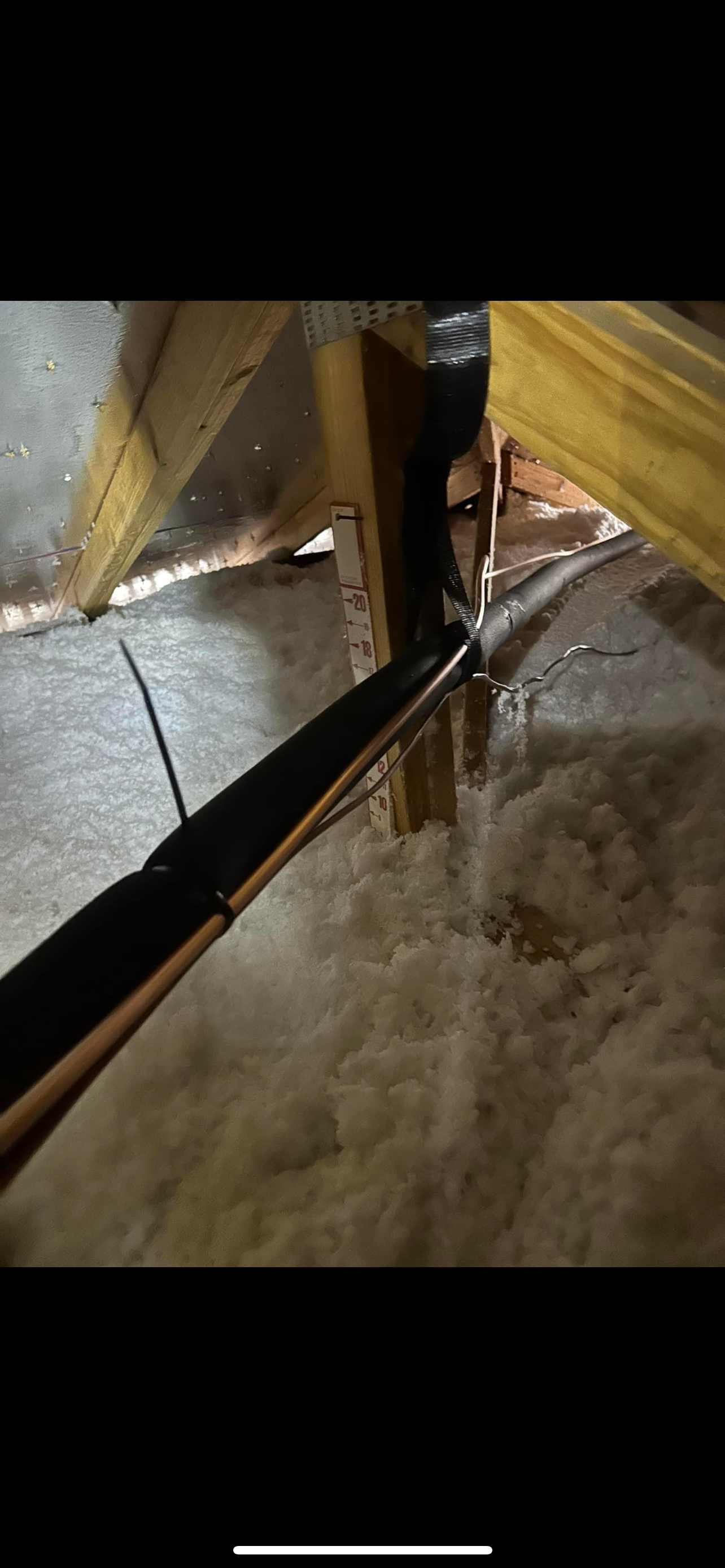 a pipe is coming out of the ceiling of a room .