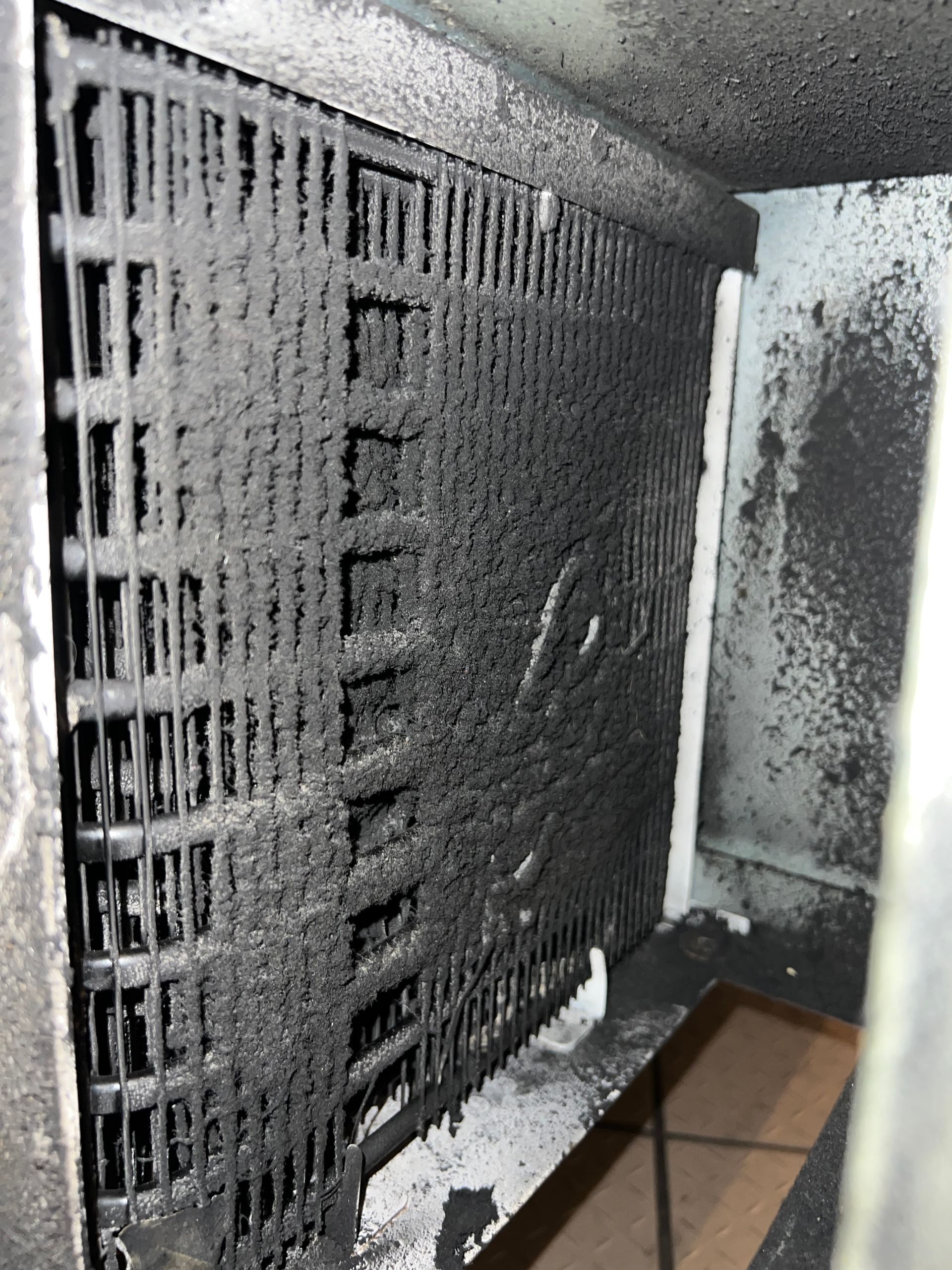 a close up of a dirty radiator in a room