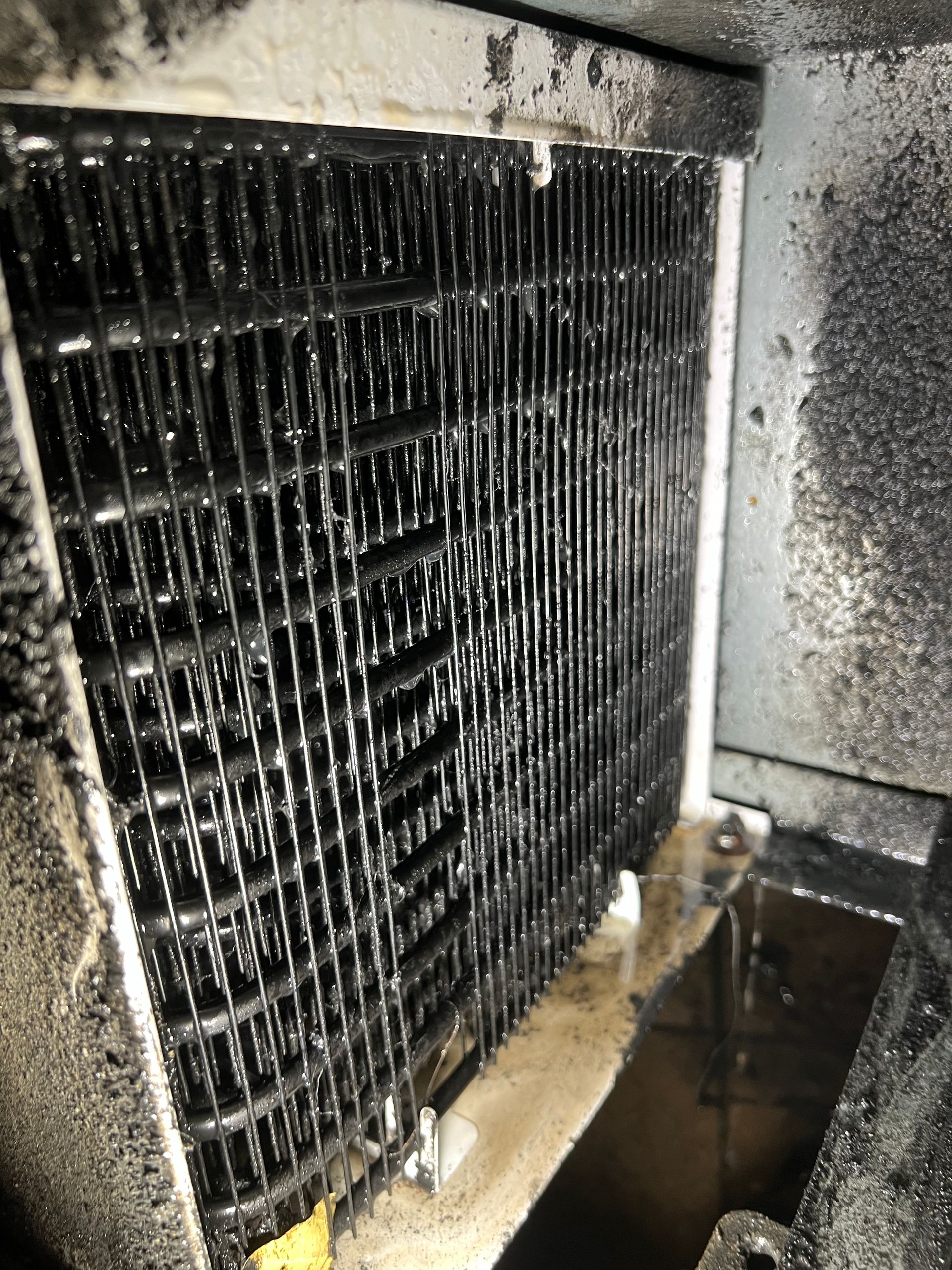 a close up of a dirty radiator in a room .